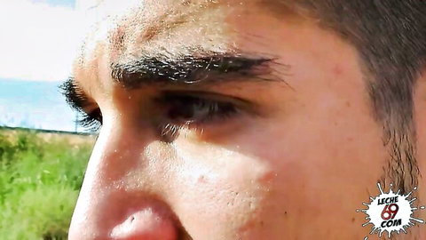 Close-up of handsome bearded man's intense profile gaze outdoors in wild porn scene