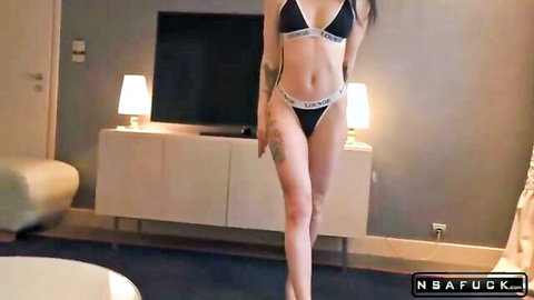 Curvy brunette in Calvin Klein bikini flaunting huge tits and thick ass tattooed thigh