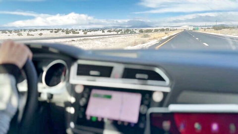 Rogan Hardy driving in snowy mountains, teasing inked wild ride