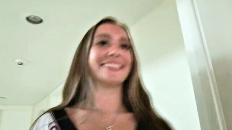 Bailey Base smiling in casual top, long hair tease