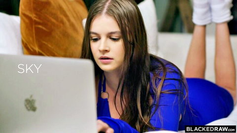 Sky Wonderland in tight blue bodysuit and thigh-high socks on laptop