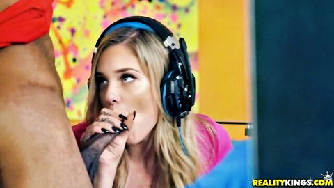 Blonde babe in headphones deepthroating massive black cock with intense eye contact