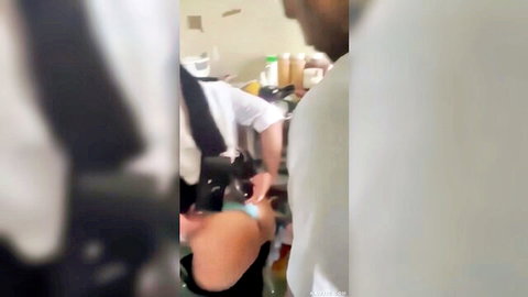 Blurry scene of prisoner engaging with female guard in uniform during explicit encounter