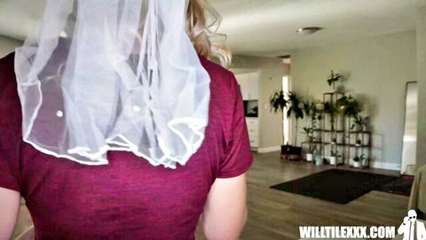 Rebel Rhyder as sexy bride in white veil, blonde hair, red top from behind