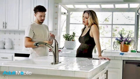Kayla Paige and Apollo Banks flirt in black dress kitchen scene