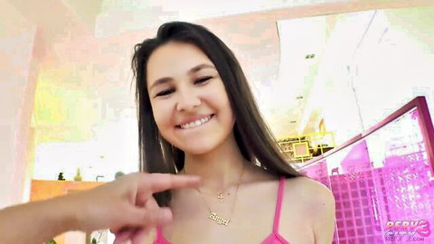 Liz Jordan smiling in pink tank top, necklace, teasing for big dick anal