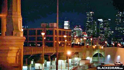 Dana DeArmond in urban LA night skyline for The Real Deal adult scene