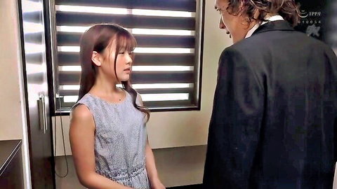 Yui Nagase in gray dress talking to suited man in JAV interracial preview