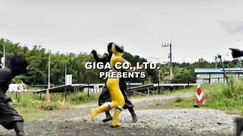 Superheroine in tight yellow latex bodysuit grabbed by thugs outdoors
