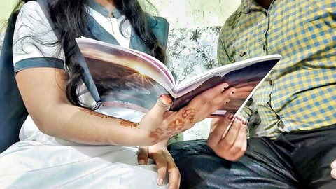 Mumbai Ashu in desi white top reading book with partner, henna hands