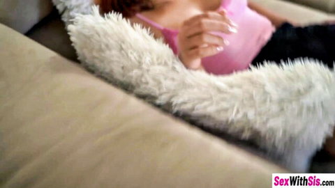 Tanned skinny stepsister exposes small perky tits pulling down pink top on couch