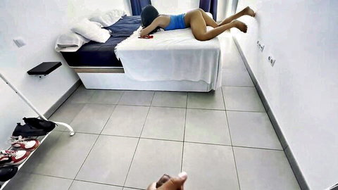 Latina babe prone on bed with bikini pulled down exposing ass and pussy getting fingered intensely from behind POV