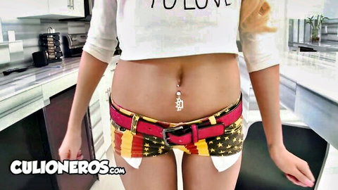 Rikki Six blonde bombshell in crop top and colorful shorts, navel piercing tease