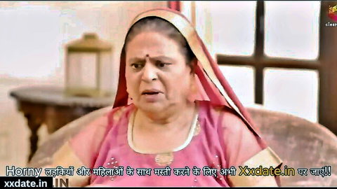 Mature Indian housewife in pink saree with shocked open mouth expression teasing big tits