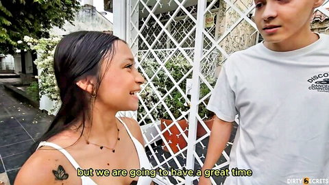 Petite brunette stepsister smiles seductively at stepbrother through gate teasing great time ahead