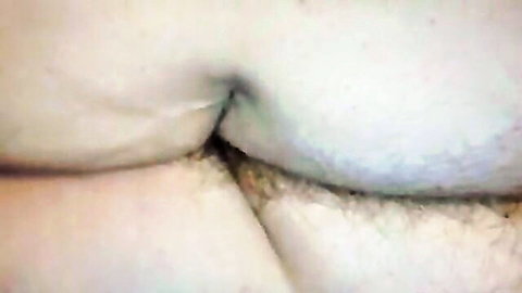 Closeup of smooth pale ass cheeks spread wide revealing tight pink anus