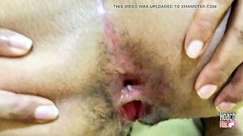 Hairy pussy spread wide open by fingers revealing gaping wet pink hole closeup