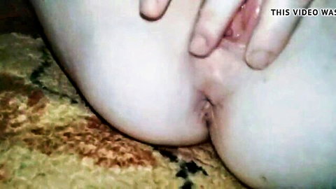 Mature woman spreading wet pink pussy close-up view