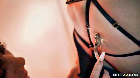 Cherie DeVille in black lingerie harness with metallic ring tease