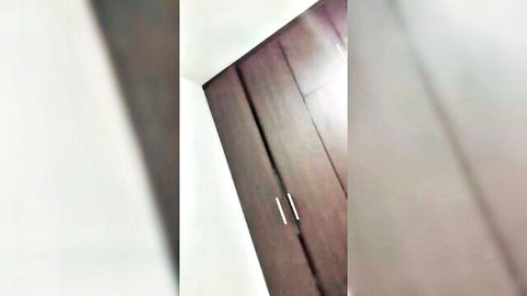 Blurry closeup of brown wooden wardrobe doors with silver handles in bedroom