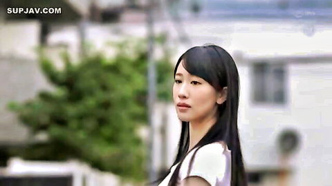 Sexy Japanese brunette wife with big tits in tight white top looking seductive outdoors