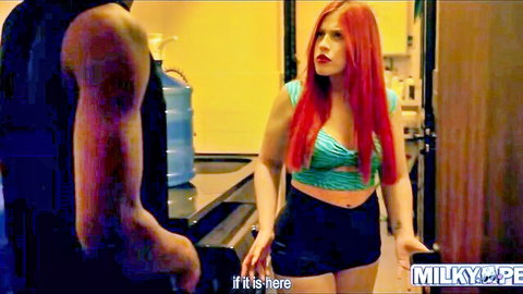Redhead Latina in green crop top and shorts with muscular man in kitchen