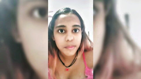 Ebony student with pink-tipped hair and cleavage in close-up selfies