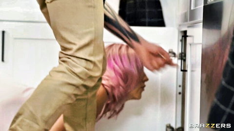 Pink-haired woman deepthroating tattooed man in intense oral scene