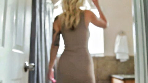 Curvy blonde with huge ass in tight beige dress teasing from behind in bathroom