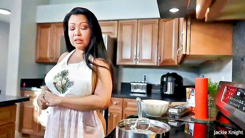 Curvy Asian MILF in sheer white apron teasing big tits while cooking in kitchen