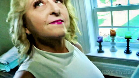 Blonde MILF Bridgette in white top, seductive gaze, PrivateSociety amateur tease