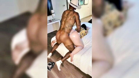 Muscular tattooed black man fucks curvy white BBW pussy doggy style on bed