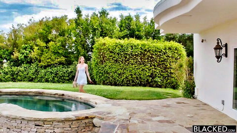 Giselle Palmer in sexy white dress by outdoor pool, teasing