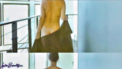 Nude petite ginger Madi Collins teasing from behind, small tattoo visible