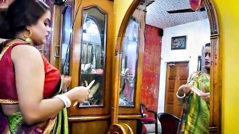 Indian chubby mom in red blouse and green saree, seductive mirror pose