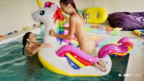 Skinny nude lesbians in pool, redhead licking brunette's wet pussy on unicorn float