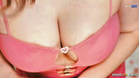 Codi Vore flaunting massive cleavage in sexy pink dress