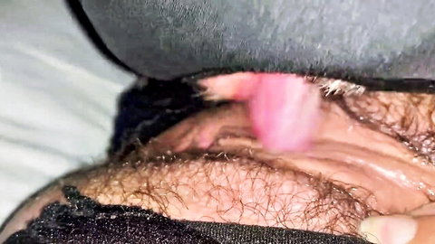 Man's pink tongue licking woman's hairy wet pussy lips closeup amateur POV