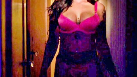 Medusa in pink bra and black lingerie, busty brunette posing seductively