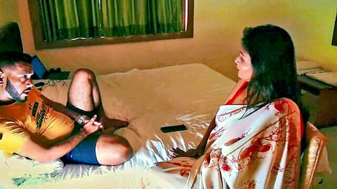 Muscular Indian man in shorts on bed eyes sexy saree-clad babe sitting nearby