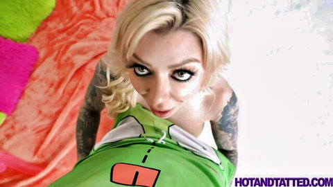 Karma Rx hot tatted blonde in seductive green top pose