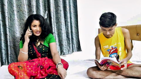 Desi stepmom in red saree on phone, enticing young stepson reading book on bed