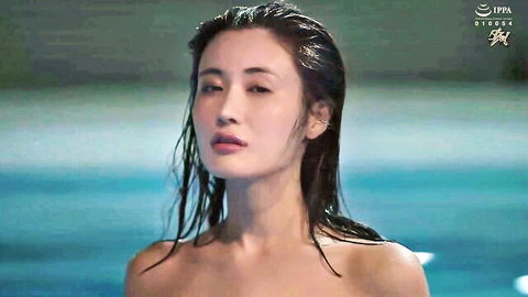 Wet topless Asian beauty with bare tits emerging from pool seductively