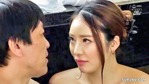 Intimate close-up of Asian couple gazing passionately in JAV scene