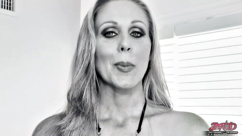 Seductive blonde MILF pouts glossy lips craving cock in closeup