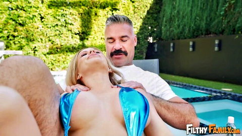 Blonde bombshell's huge tits squeezed by mustached stud in shiny blue bikini poolside