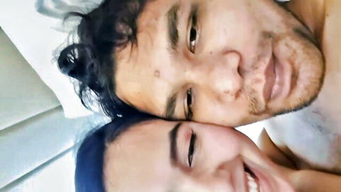 Bangla Desi couple close-up selfie, smiling intimately in bed