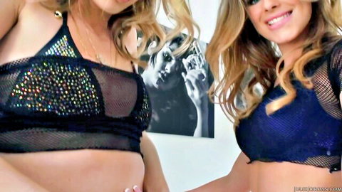 Two busty blondes in sheer sparkly lingerie tops exposing tits and smiling seductively.
