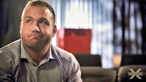 Handsome smirking DILF daddy in open collar shirt closeup