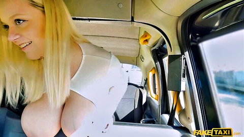 Blonde with massive tits bursting out of torn white top in Fake Taxi smiling seductively